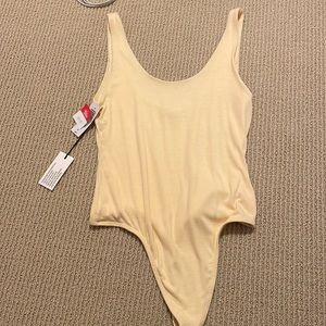 Yellow babaton bodysuit